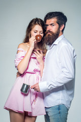 young couple with coffee cup and pot