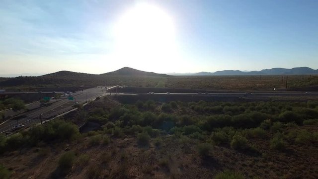 Northern Arizona highway traffic aerial pan