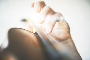 Hand playing the violin