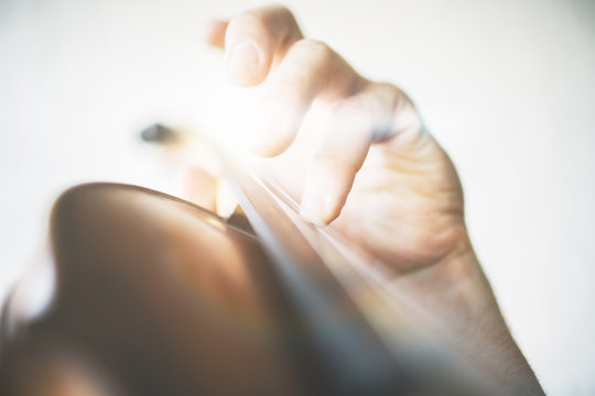 Hand playing the violin