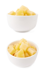 Pile of canned pineapple over isolated white background