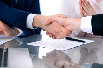 Business people shaking hands finishing up a meeting