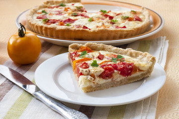 Tart with salted sheep cheese and tomatoes