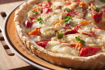 Tart with salted sheep cheese and tomatoes