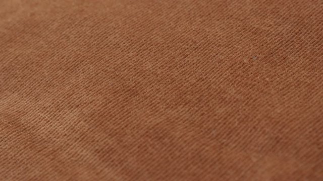 Maroon velvet textile for clothing like trousers or shirts slow tilt 4K 2160p 30fps UltraHD tilting footage - Tilting over corduroy striped brown pants fabric 3840X2160 UHD video 