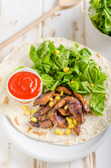 Chicken teriyaki salad on tortilla