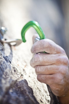 A man sport climbing in the Canadian Rockies. Snake Eyes, 10c, Cougar Creek, Canmore, Alberta, Canada 