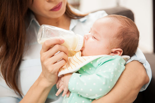 Newborn baby drinking some milk