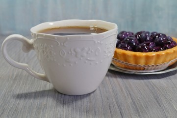 Hot black tea in a white cup
