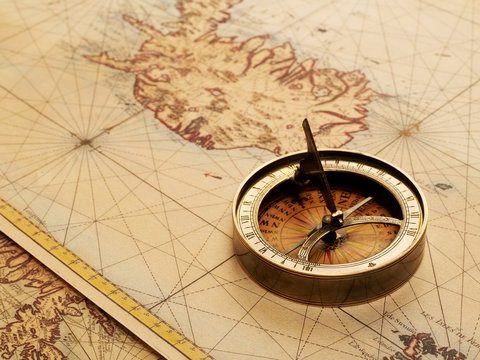 Old compass and ancient map