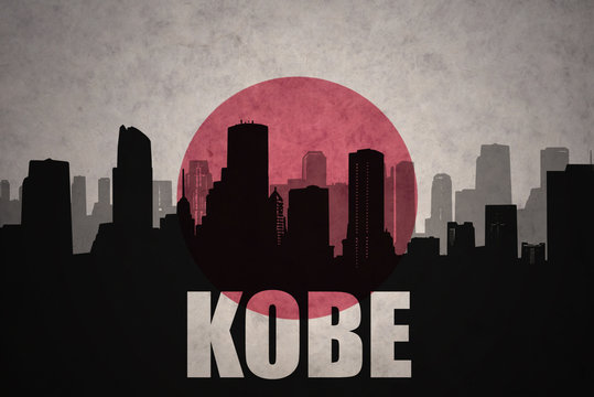 abstract silhouette of the city with text Kobe at the vintage japanese flag background