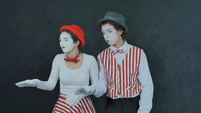 Two young mime dancing