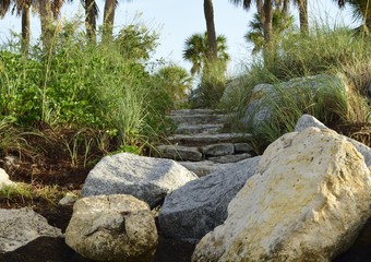 Uneven rock stairway to the beach on the Gulf of Mexico.