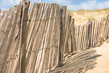 Wooden fence on Atlantic beach in France