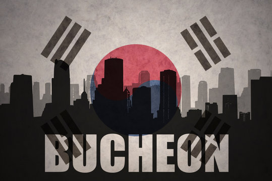 abstract silhouette of the city with text Bucheon at the vintage south korea flag background