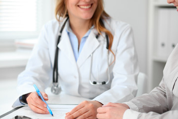 Doctor and  patient  sitting at the desk