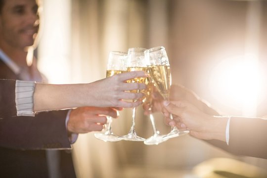Group of businesspeople toasting glasses of champagne