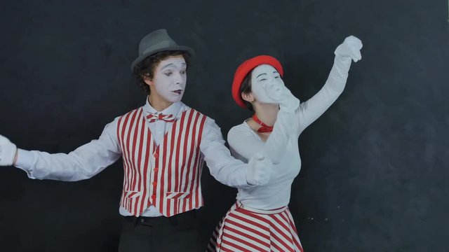 Mimes playing musical instruments