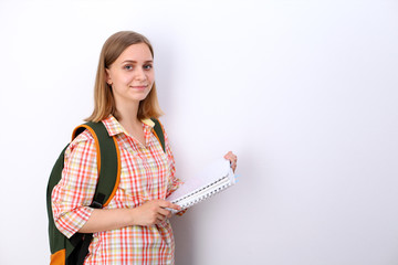 Happy young student girl holding books, study, education, knowledge, goal concept
