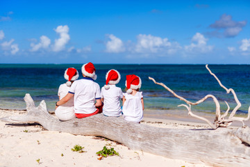 Family celebrating Christmas at beach