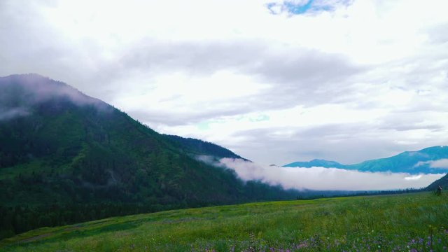 taymlaps clouds and fog passes through the clouds. It Altai, Kazakhstan or Mongolia
