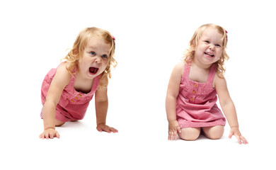 Young little girl crawling over isolated white background
