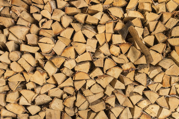 stack of firewood and an ax
