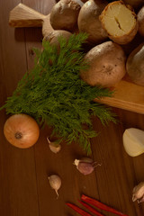 baked potatoes and spices on a wooden table