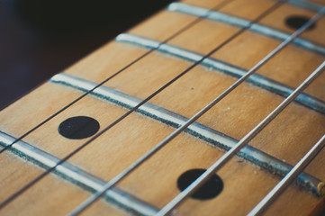 Electric guitar neck detail, music symbol