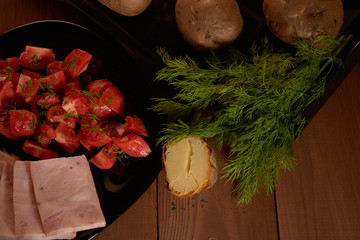 baked potatoes and a salad of tomatoes