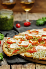 tomato mozzarella kale pesto pizza