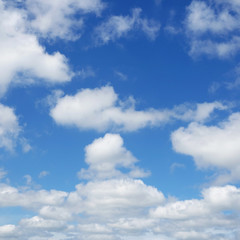 Fototapeta na wymiar White clouds flying against blue sky.