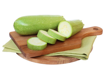 Green zucchini on the board