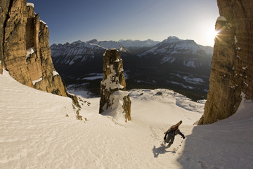 A backcountry skier hiking with ski gear, Bow Peak, Icefields Parkway, Banff National Park, Alberta, Canada