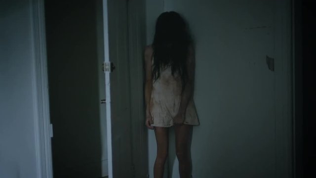 Crazy Possessed Girl Behind a Door