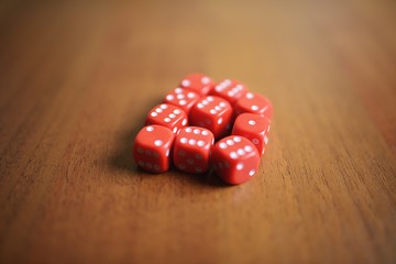 Ten red dice on a table