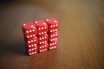 Six red dice on a table