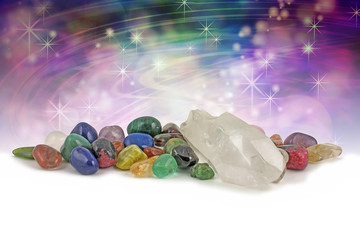 Magical healing crystals - large clear crystal terminated quartz specimen surrounded by a selection...