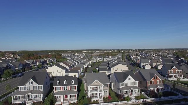 An aerial establishing video of a suburban neighborhood, 4K UHD