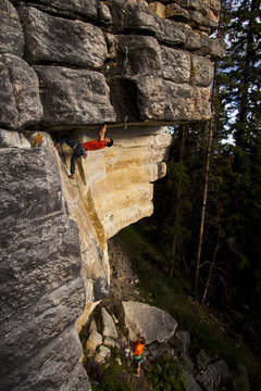 A strong male climber works on Supernatural zombie suspense thriller 11d, Silver City, Castle Mtn, Banff, AB