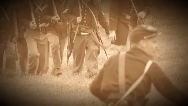 Civil War soldiers marching across field (Archive Footage Version)