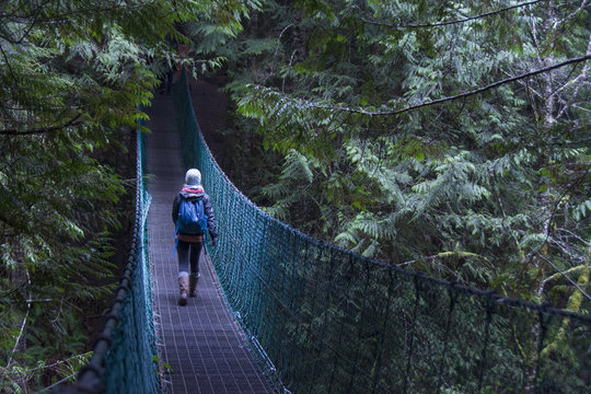 Suspension bridge and hikers Juan de Fuca trail near China Beach, near  Victoria, BC,  Canada