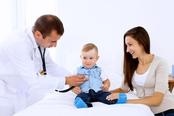 Little boy child  with his mother  at  health exam at doctor's office