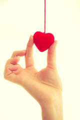Obraz premium Female hand with little heart.