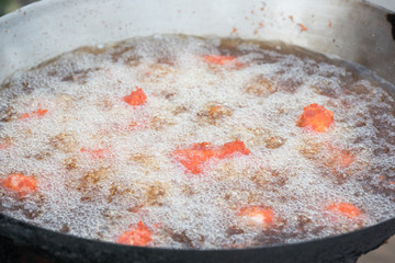 thai style deep fried chicken in hot boiled oil