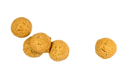 Five scattered ginger nuts seen from above