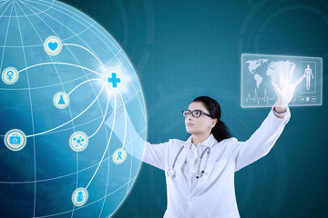 Doctor with medical icon on virtual screen