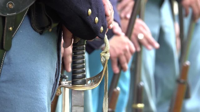 Civil War soldiers guns and a sword