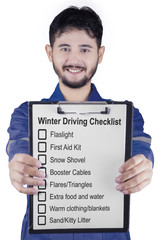 Workshop worker shows winter driving tips