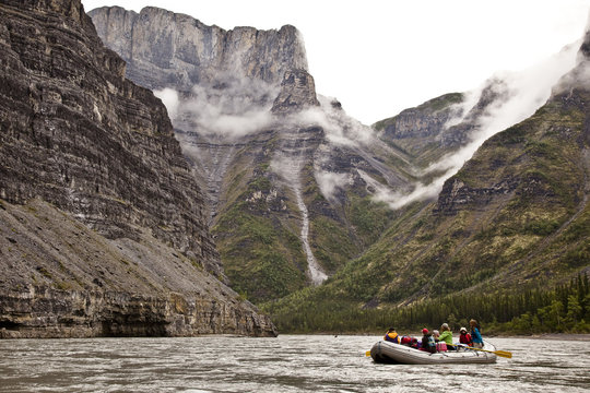 Group of women (mothers and daughters) on raft on Nahanni River, Nahanni National Park Preserve, NWT, Canada.